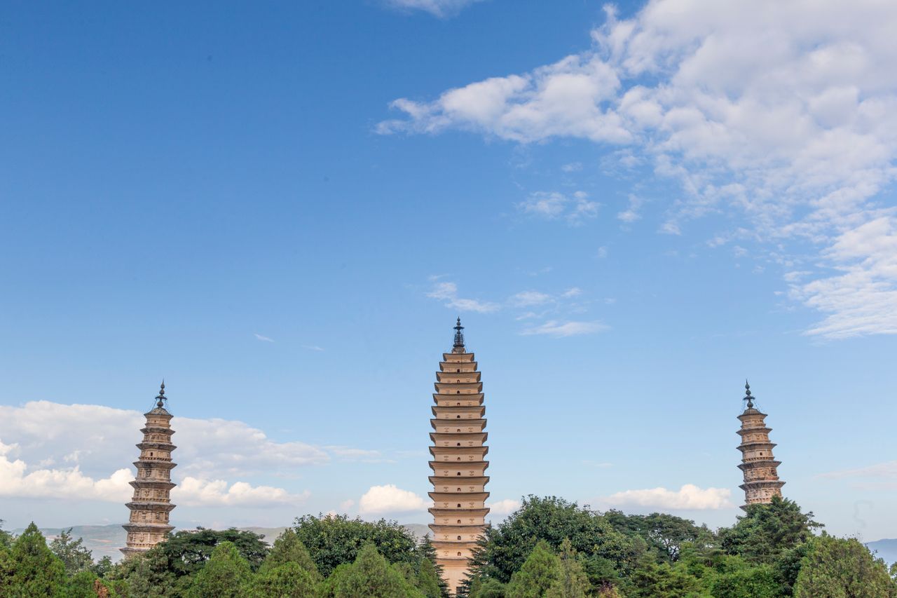 The iconic Three Pagodas at Chongsheng Temple against a clear blue sky, Yunnan, China.